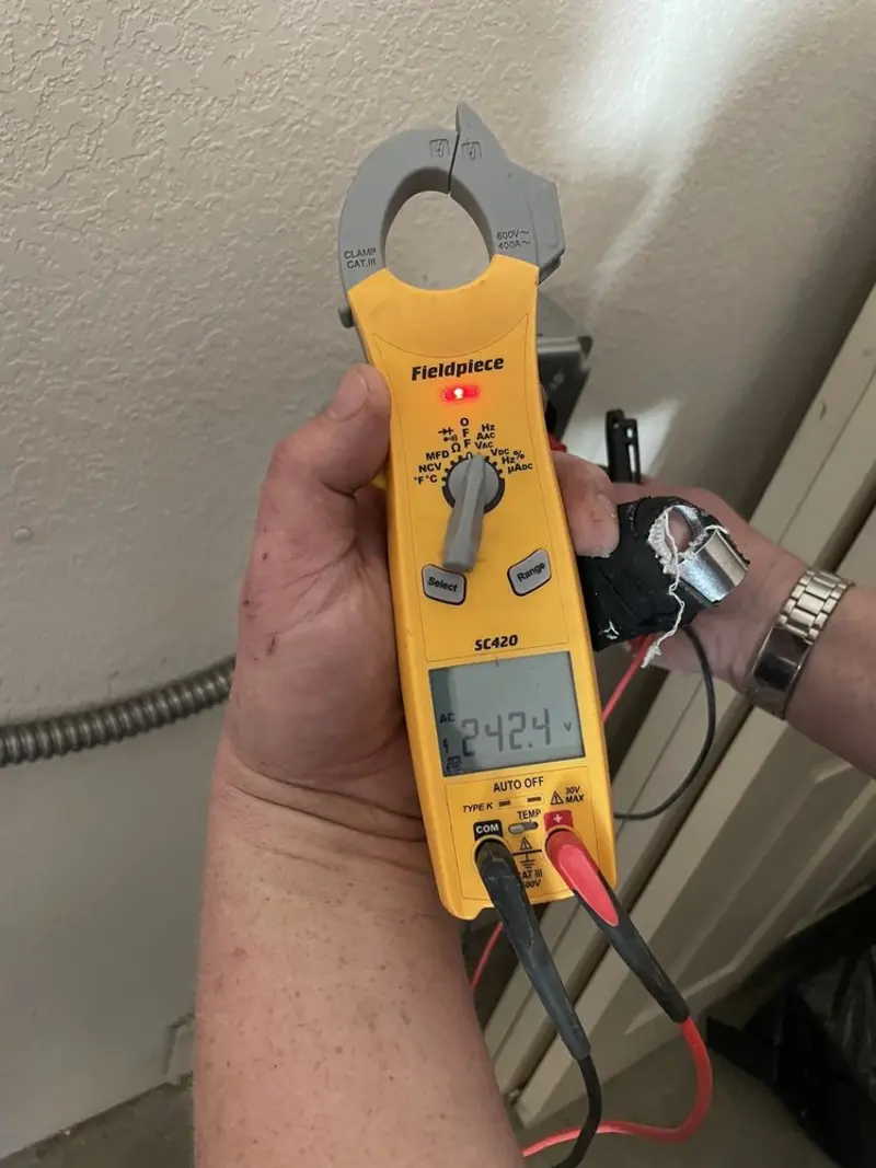 Voltage testing with clamp meter during Recessed Lighting Installation in Forest Grove
